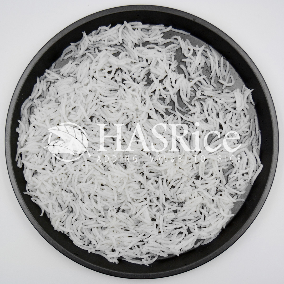 Cooked 1121 Steam Basmati showing firm separated grains with near-white appearance